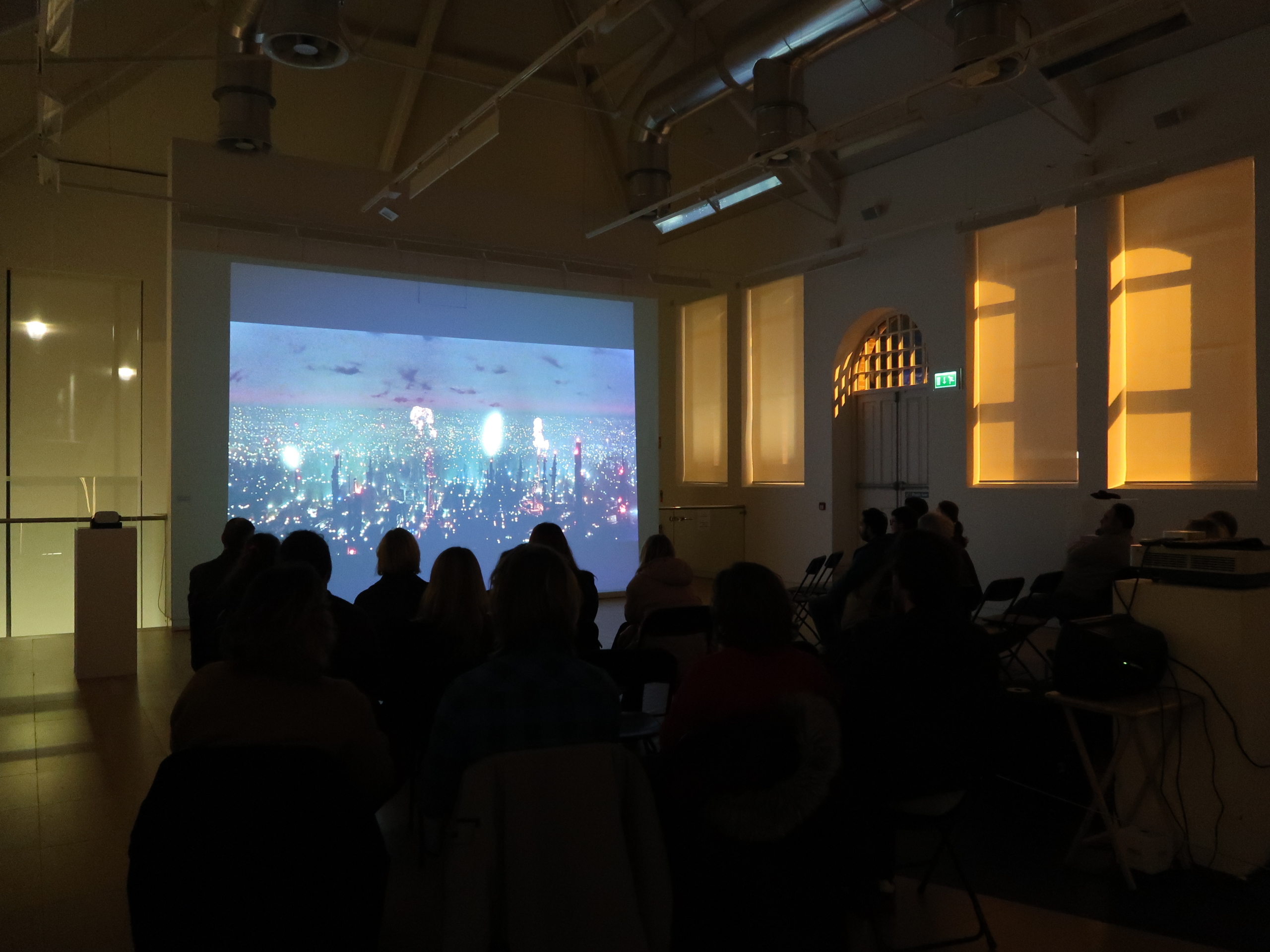 Film screening Blade Runner at Luan Gallery - Dark room with a screen