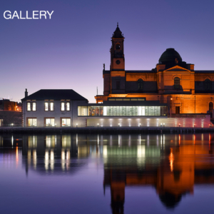 Luan Gallery Postcard - The Gallery at night lighted up, mirroring in the water