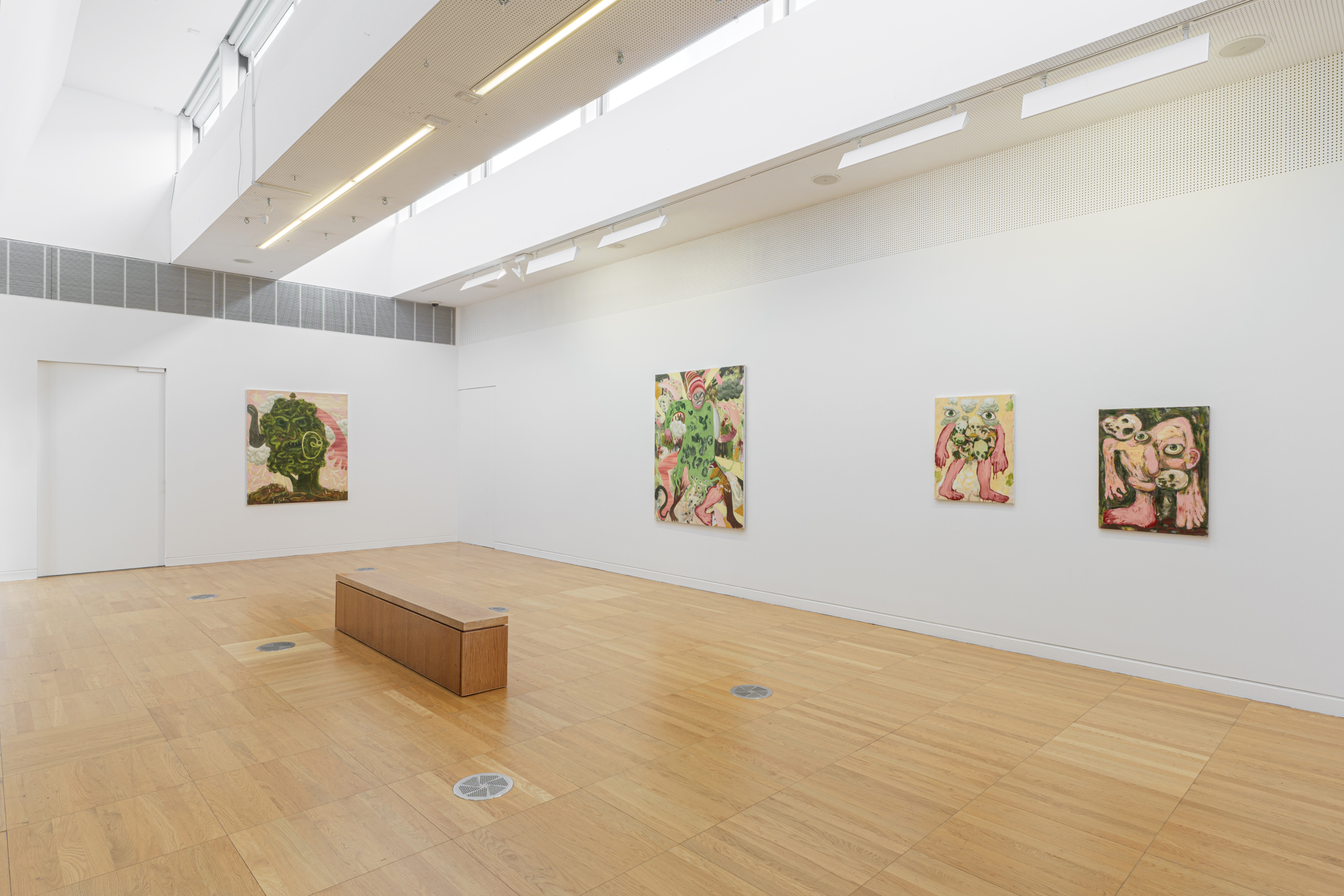 Colourful art on a white wall at the exhibition Tuberclerosies at Luan Gallery