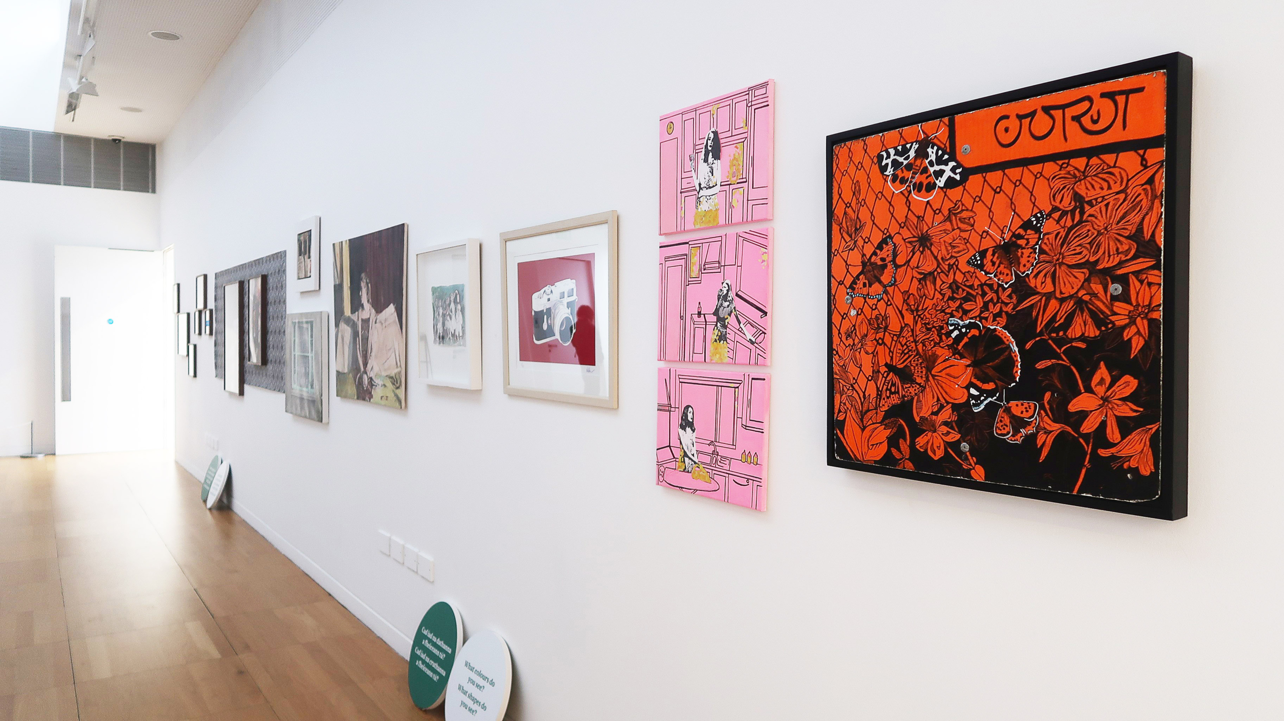 Colourful art on white wall from the exhibition Connections at Luan Gallery