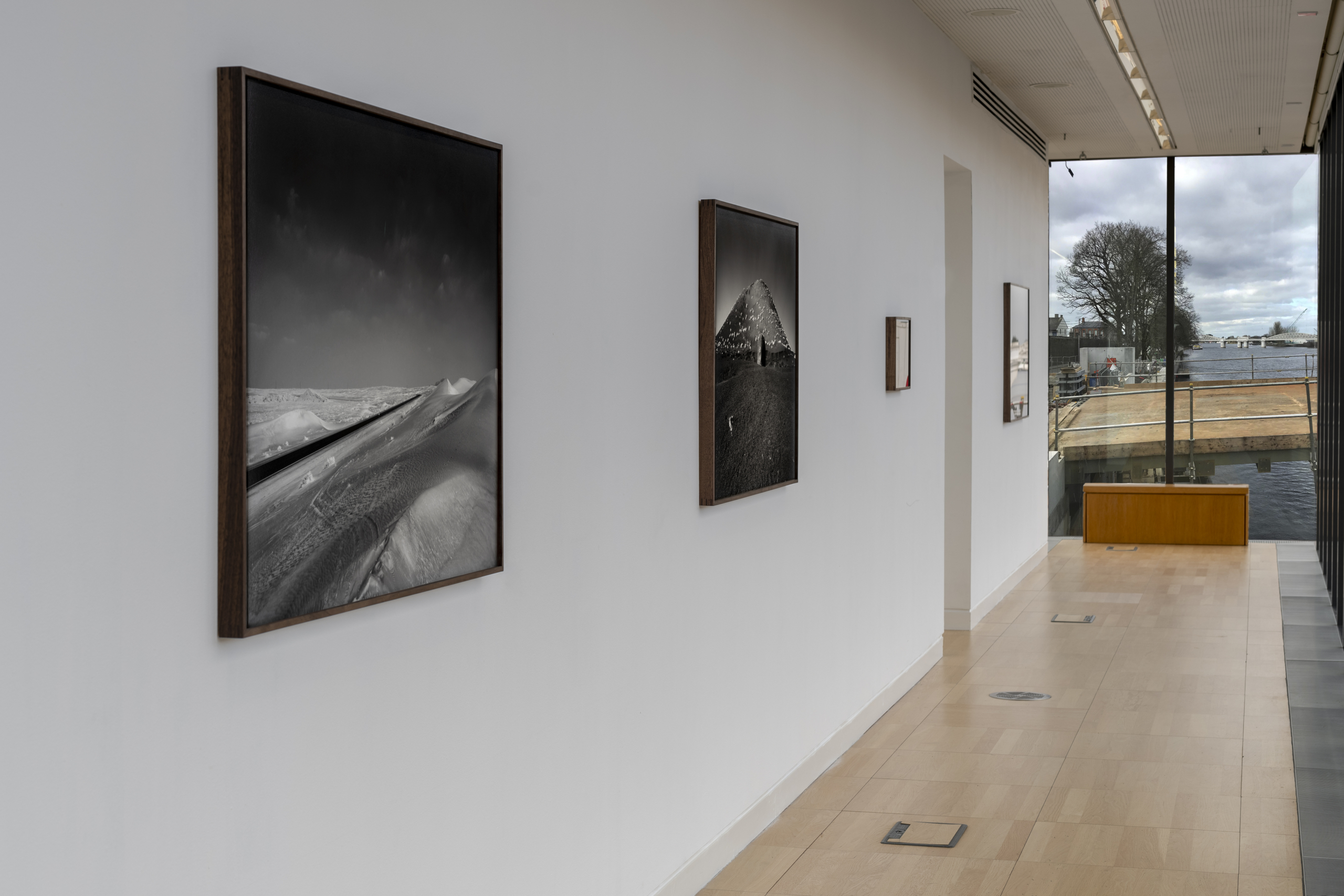Art in black and white on a white wall at Luan gallery. The exhibition "At the gates of silent memory"