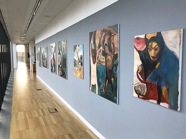 Colourful art on grey wall at Luan Gallery - exhibition "Midden"