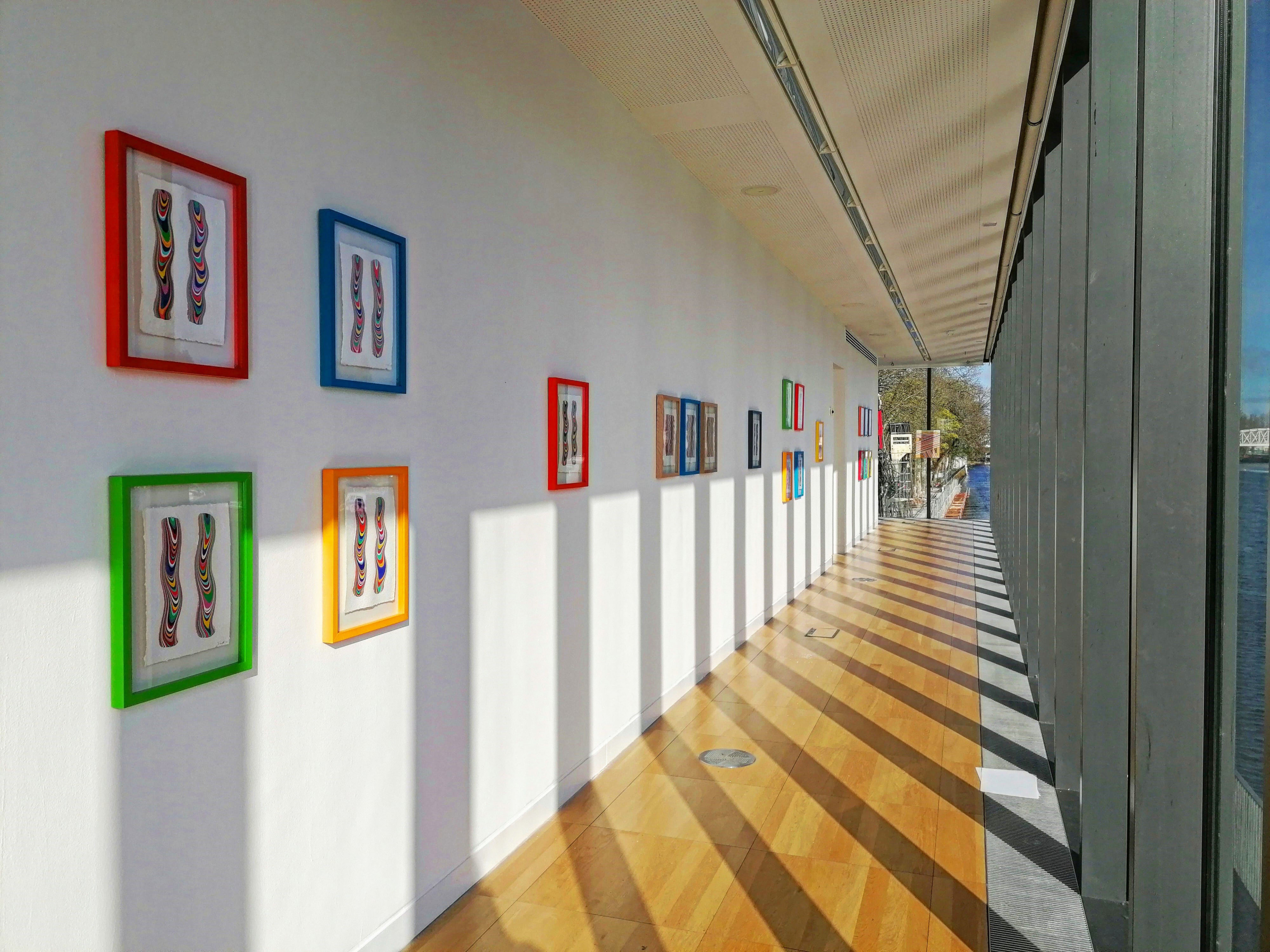 colourful frames with art pieces at Luan Gallery