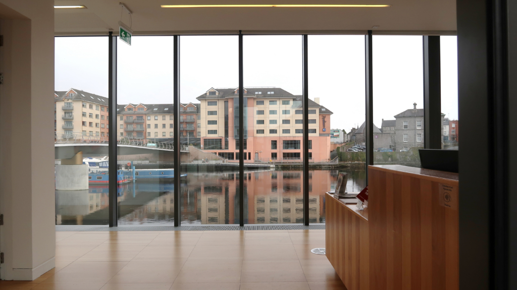 Luan Gallery reception with canal view on cloudy daw